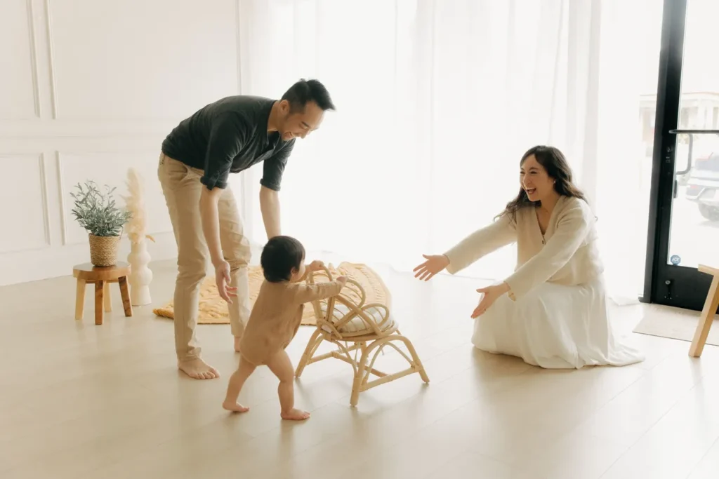 Photo of Dr. Yau with her husband and daughter in a home setting