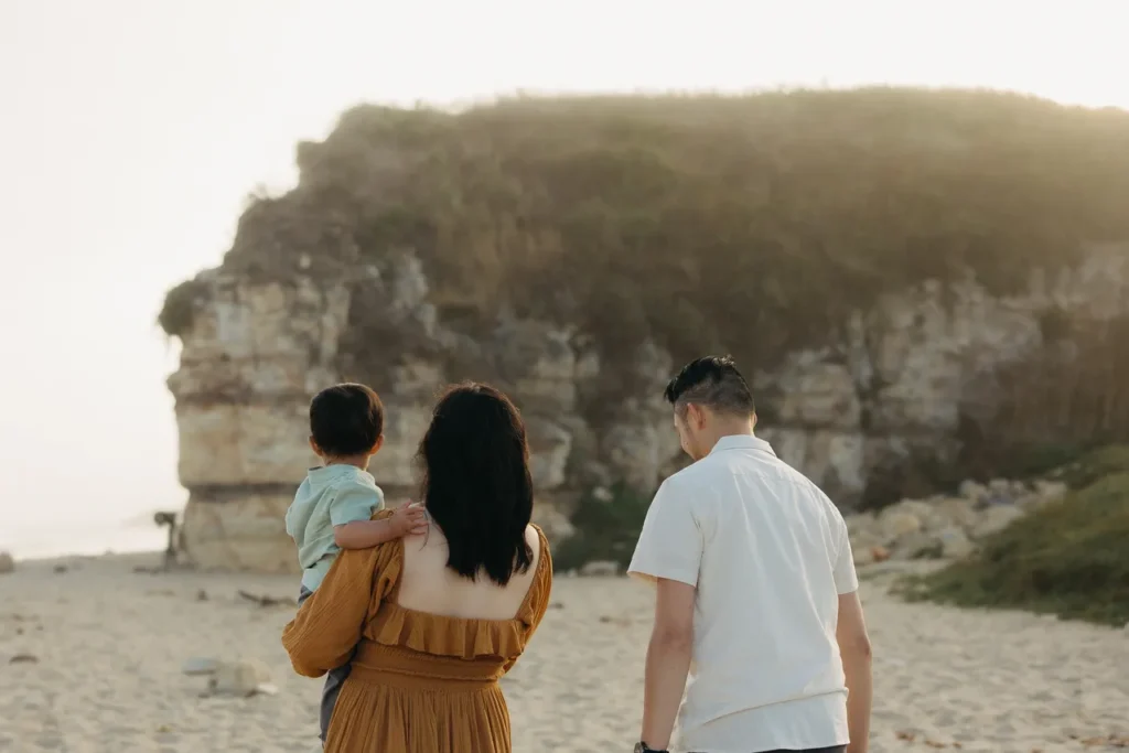 Photo of Dr. Yau, with her husband and son at the beach